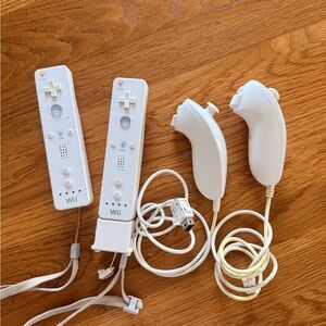 Nintendo White Wii Remotes with Matching White Nunchuks